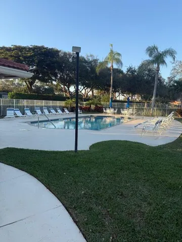 a view of a water fountain and a big yard
