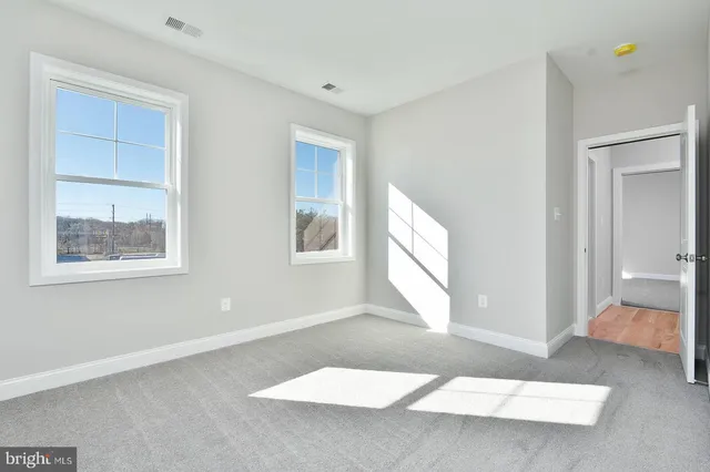 a bathroom with a sink double vanity and a mirror