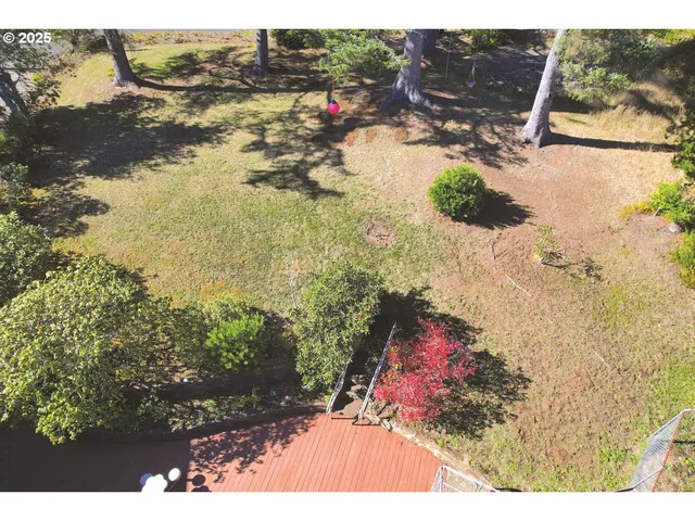 a view of balcony with wooden floor and fence