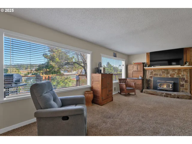 a view of a dining room with furniture window and outside view