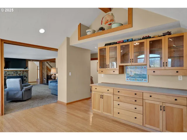 a kitchen with stainless steel appliances kitchen island granite countertop a sink and cabinets