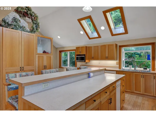 a spacious bedroom with a bed and a window