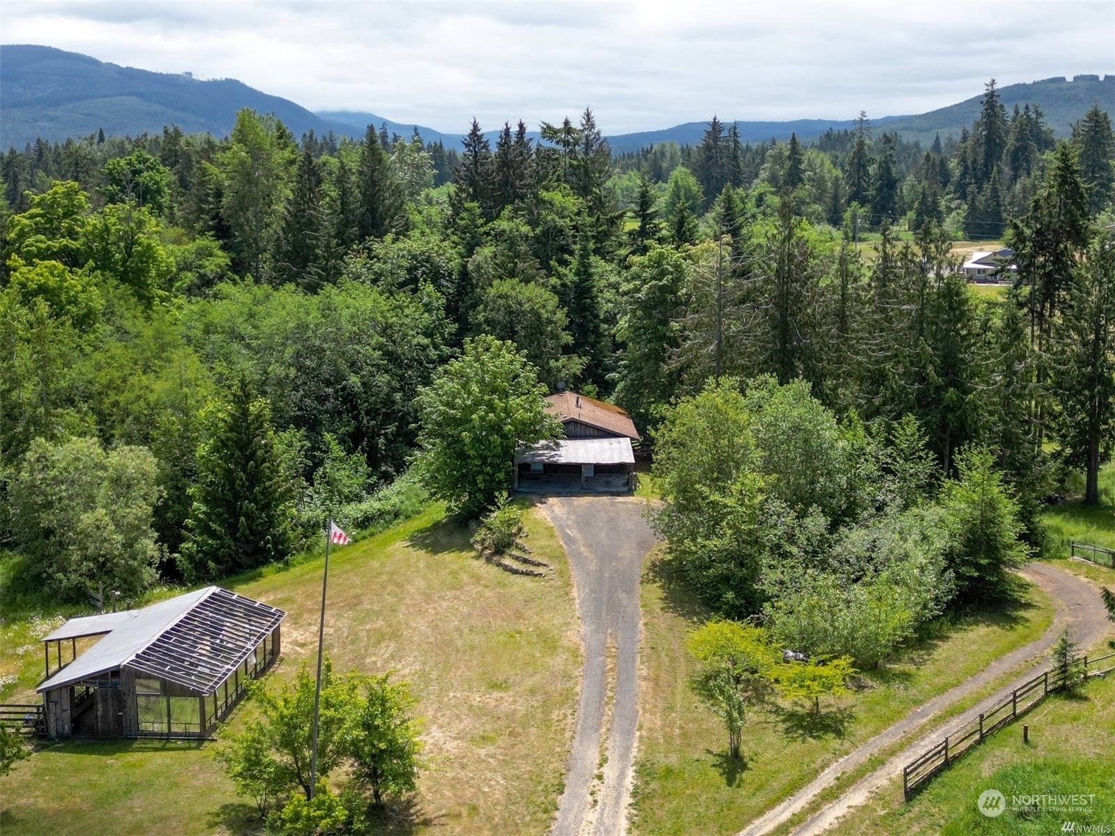 252 Lavender Ridge Lane Sequim, WA 98382 - Photo 1 of 28 a view of a garden with a building in the background
