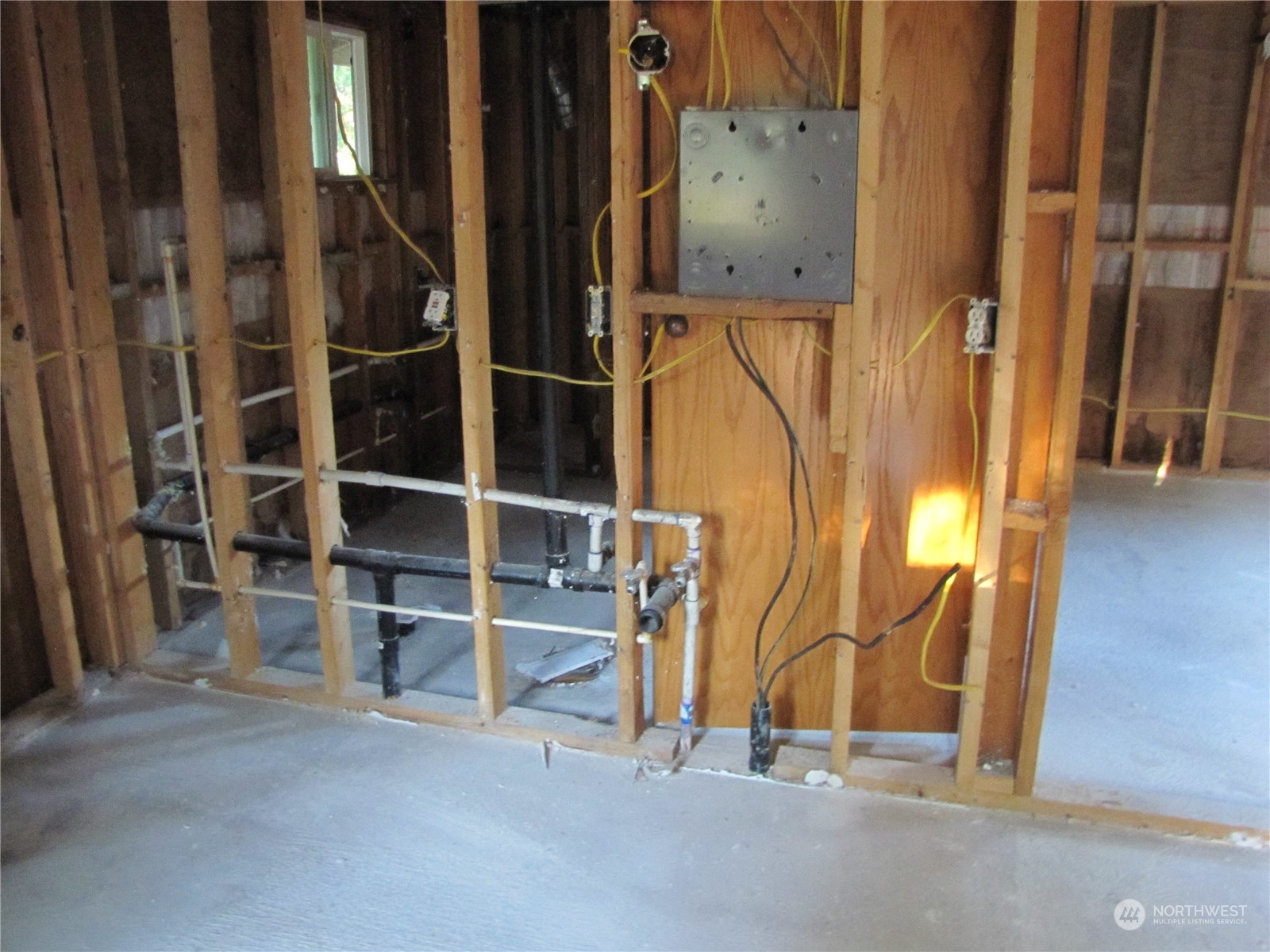 252 Lavender Ridge Lane Sequim, WA 98382 - Photo 20 of 28 a view of an empty room with wooden floor and a window