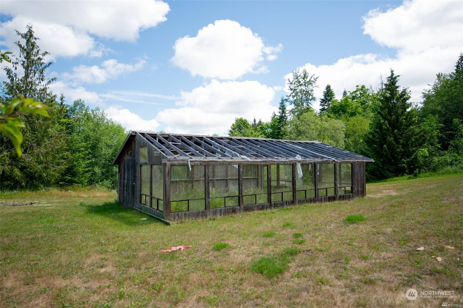 252 Lavender Ridge Lane Sequim, WA 98382 - Photo 27 of 28 a view of a house with a backyard