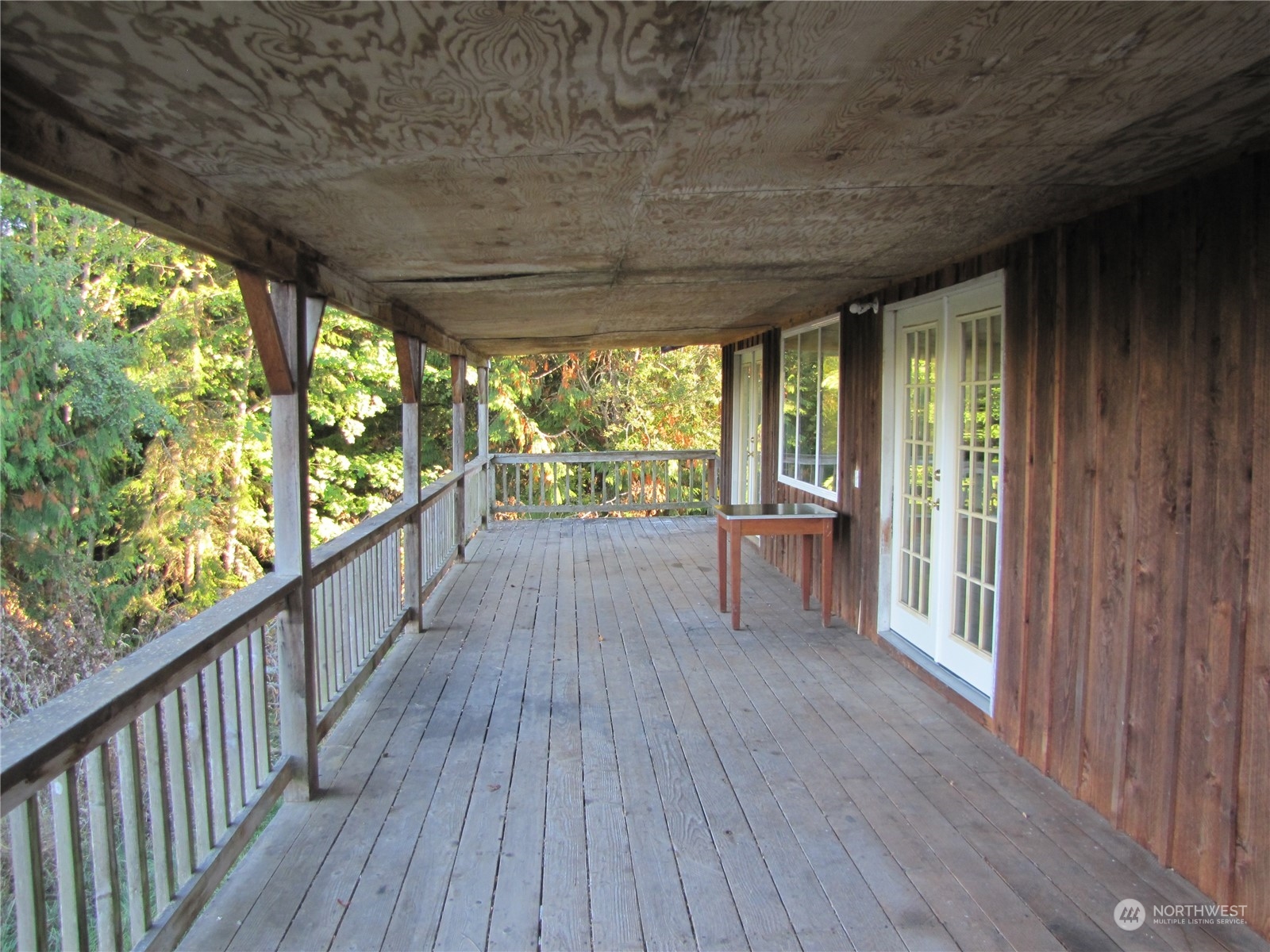 252 Lavender Ridge Lane Sequim, WA 98382 - Photo 3 of 28 a view of a porch with wooden floor and outdoor space