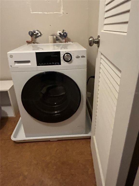 2500 Lee Road, Unit 229 Winter Park, FL 32789 - Photo 18 of 41 a utility room with dryer and washer
