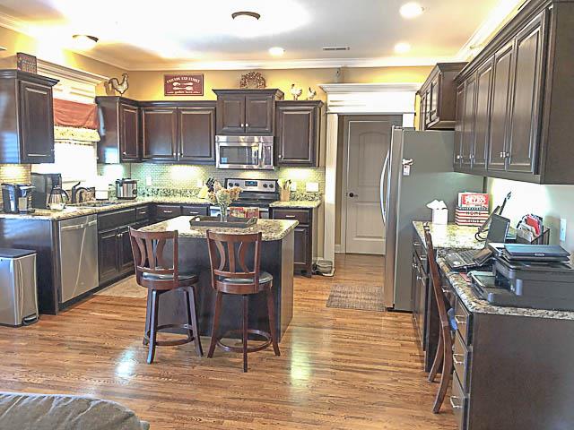1242 Rimrock Road Smyrna, TN 37167 - Photo 8 of 28 Great open kitchen - with built-in desk - the kitchen island is movable - place it wherever you would like!