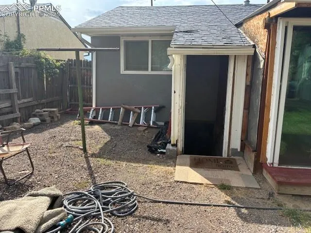 a view of a porch with a table and chairs