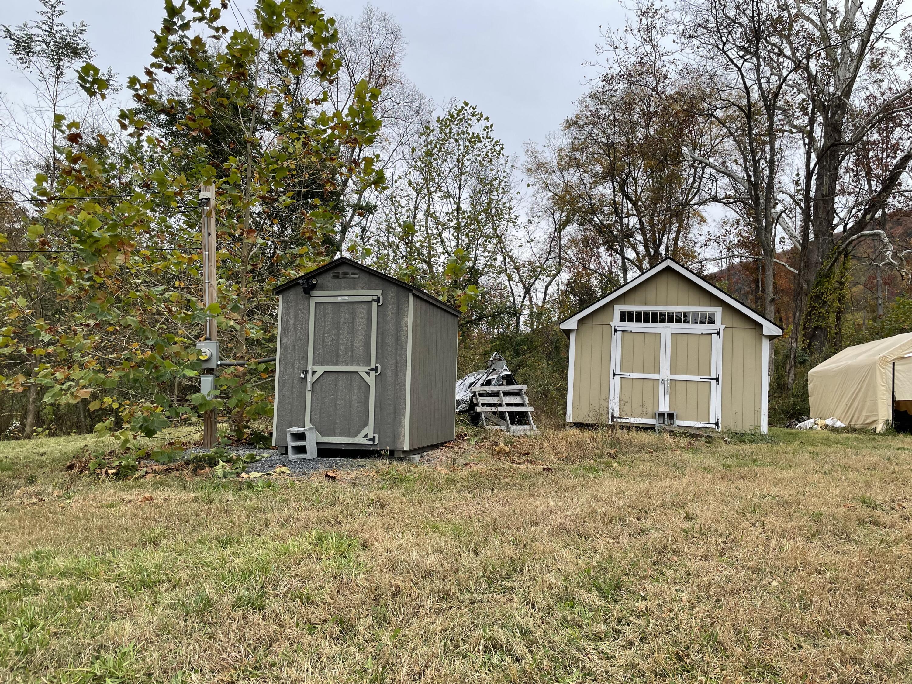 5829 Bradshaw Road Salem, VA 24153 - Photo 15 of 35 a view of a house with a yard and large tree