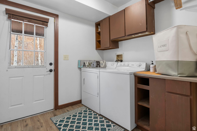 2189 Samak Park Loop, Unit 43 Kamas, UT 84036 - Photo 20 of 48 Laundry area featuring cabinet space, light wood-type flooring, and washer and dryer