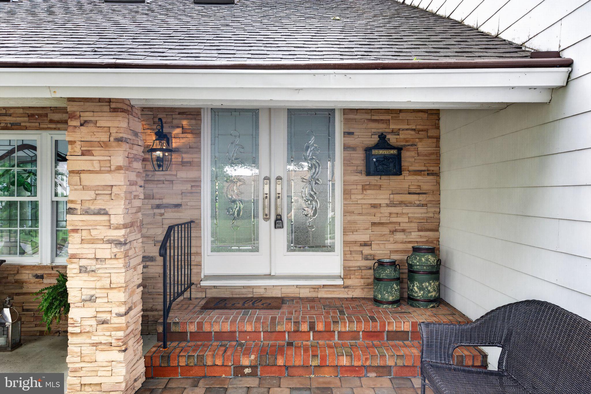 Charming entryway with stone accents.