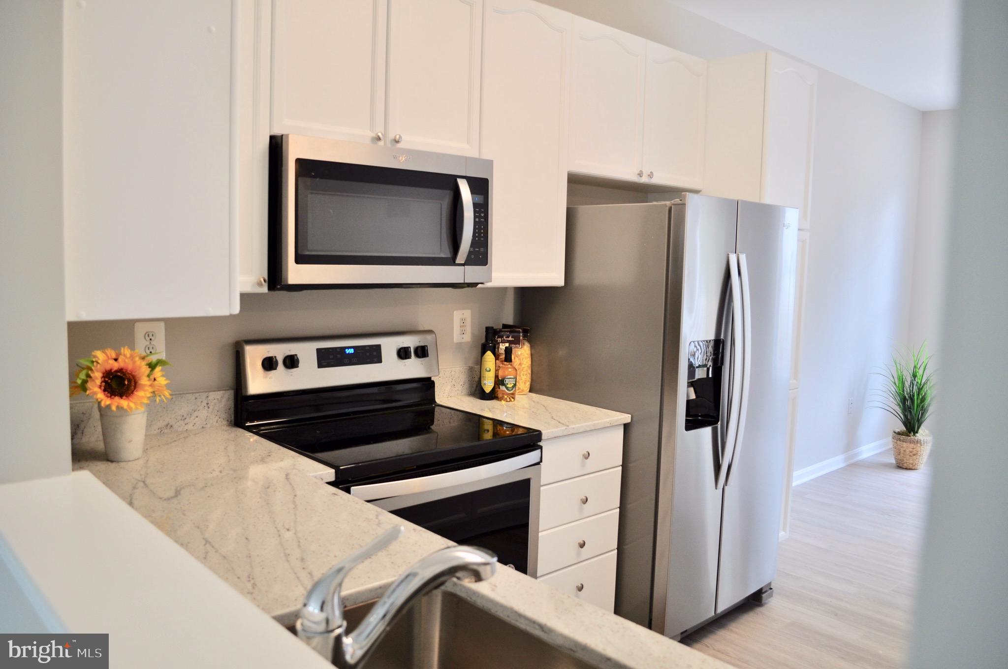 9408 Singleton Place Frederick, MD 21704 - Photo 11 of 49 Pass through window into living area