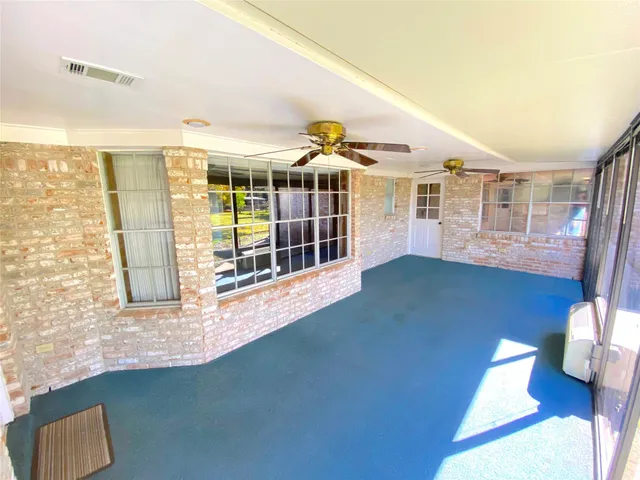 a view of an empty room and window