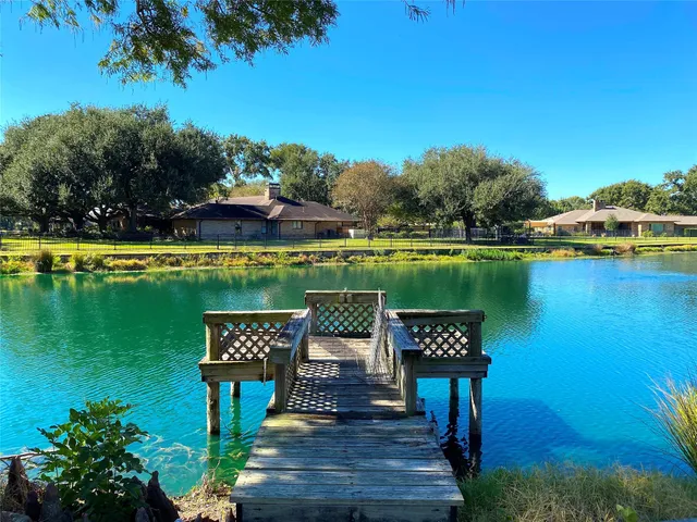 a view of a table and chairs under an umbrella