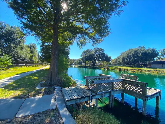 a view of a swimming pool with an outdoor space and seating area