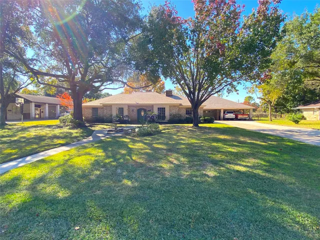 a view of a cars park in front of house