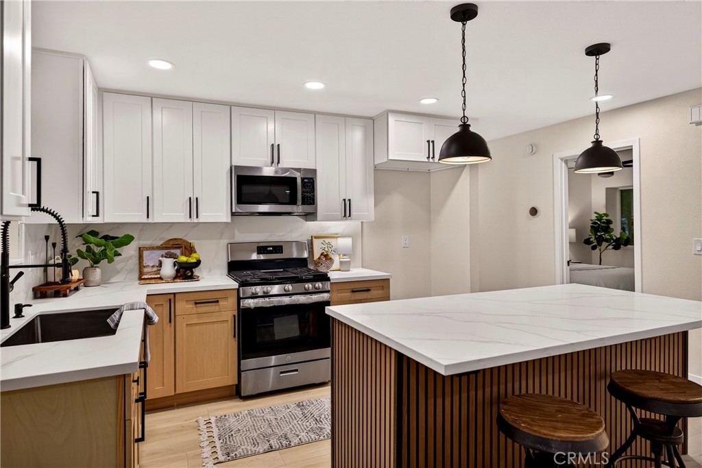 1623 Diamond Chico, CA 95928 - Photo 13 of 51 a kitchen with a stove a sink and a refrigerator