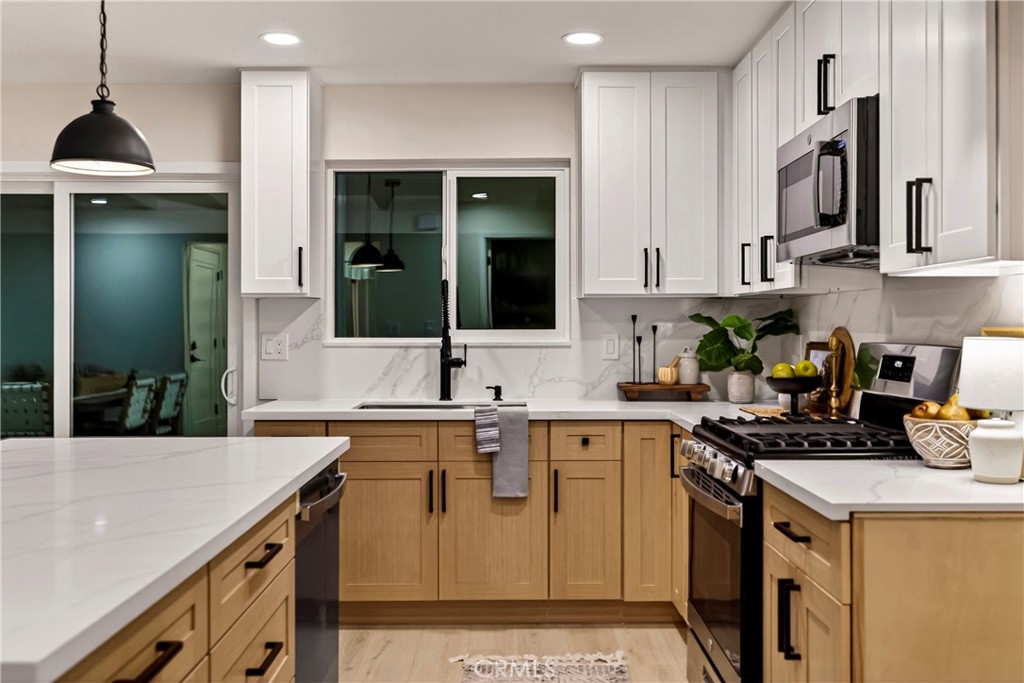 1623 Diamond Chico, CA 95928 - Photo 16 of 51 a kitchen with stainless steel appliances granite countertop a sink a stove and cabinets