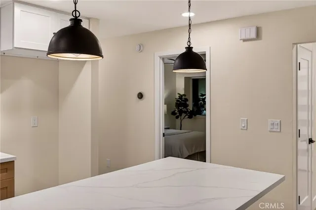 a bedroom with a bed a couch and a window