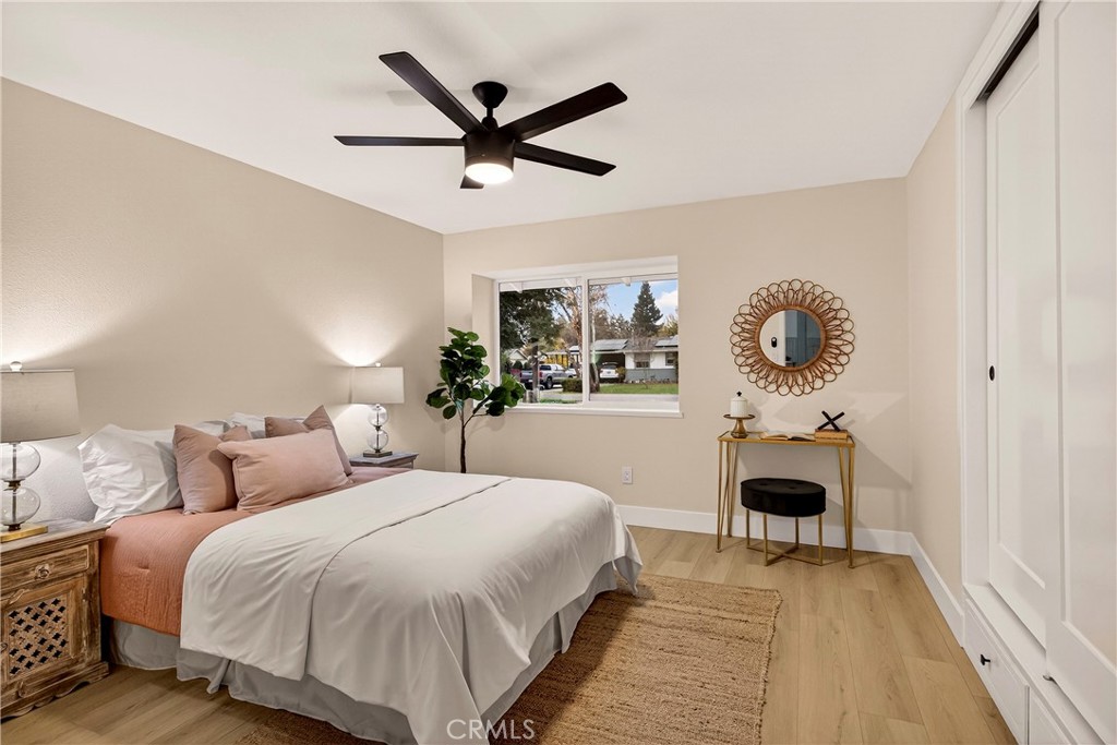 1623 Diamond Chico, CA 95928 - Photo 29 of 51 a bedroom with a large bed and a chandelier