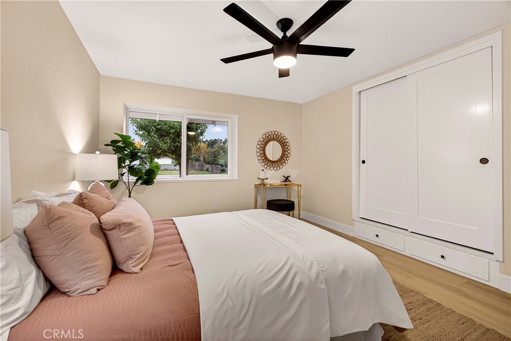 1623 Diamond Chico, CA 95928 - Photo 31 of 51 a bedroom with a large bed and a chandelier