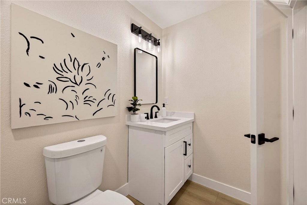 1623 Diamond Chico, CA 95928 - Photo 33 of 51 a bathroom with a toilet sink and mirror