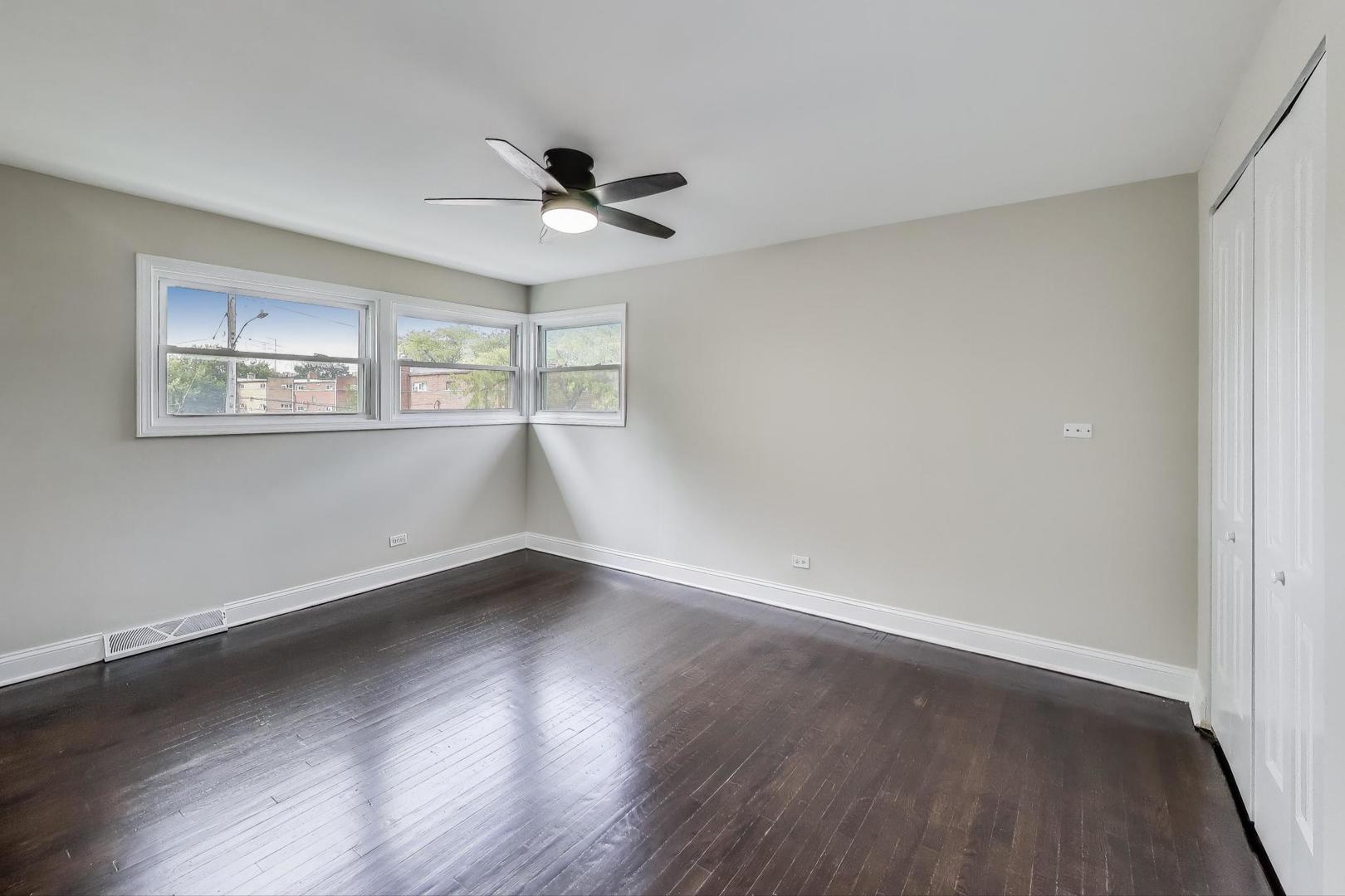 2019 Georgetown Lane, Unit 2019 Waukegan, IL 60085 - Photo 16 of 31 a view of an empty room with wooden floor and a window