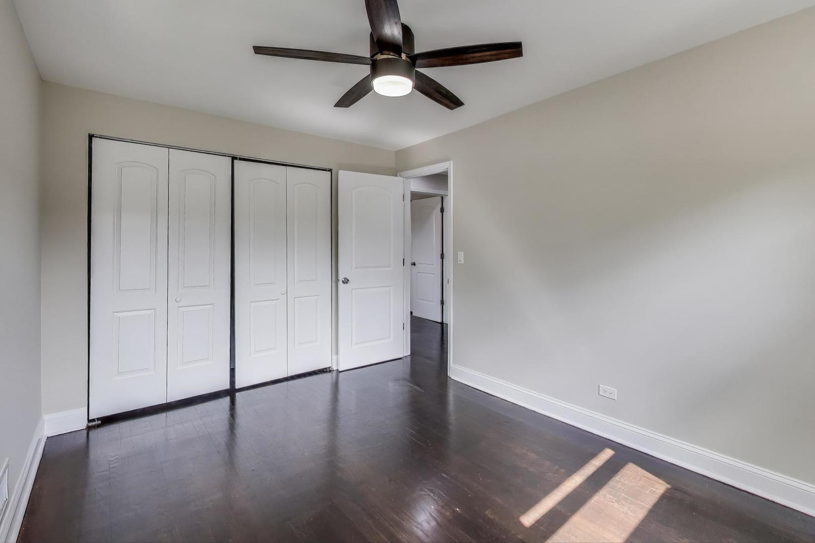 2019 Georgetown Lane, Unit 2019 Waukegan, IL 60085 - Photo 20 of 31 a view of an empty room with a window and wooden floor