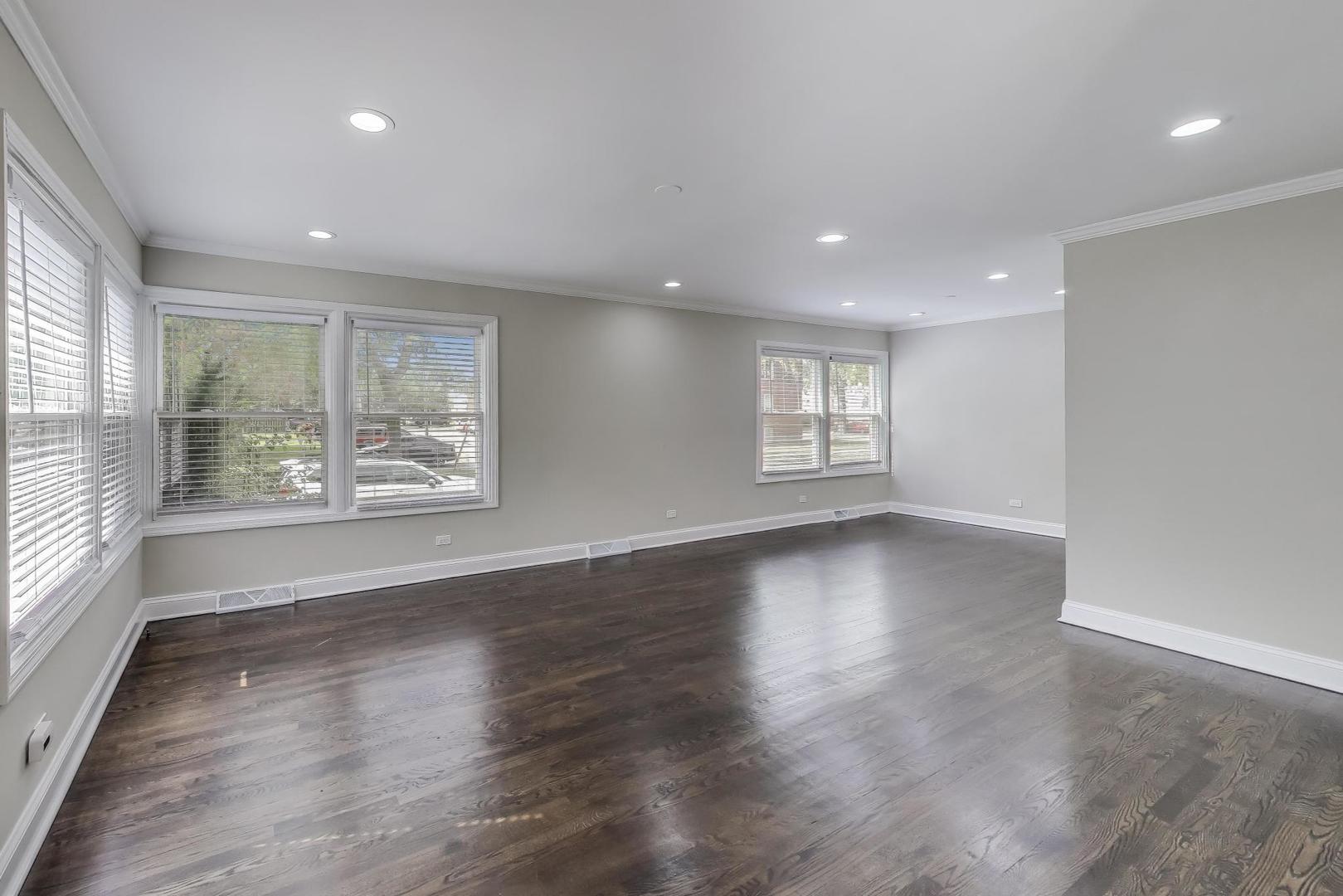 2019 Georgetown Lane, Unit 2019 Waukegan, IL 60085 - Photo 7 of 31 an empty room with wooden floor and windows