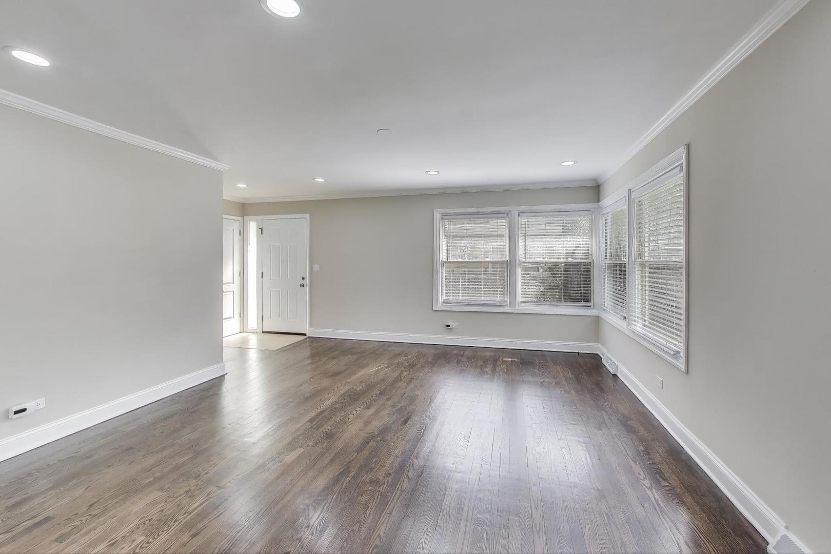 2019 Georgetown Lane, Unit 2019 Waukegan, IL 60085 - Photo 8 of 31 wooden floor in an empty room with a window