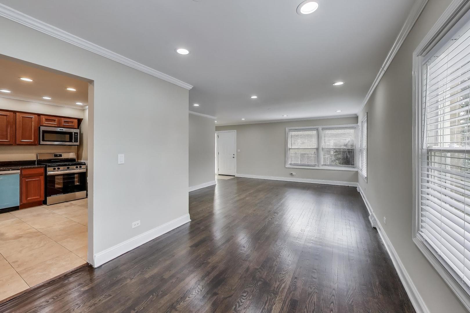 2019 Georgetown Lane, Unit 2019 Waukegan, IL 60085 - Photo 10 of 31 an empty room with wooden floor and windows