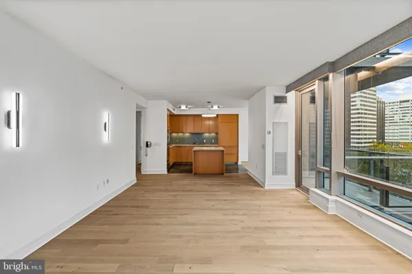 a kitchen with a stove and a large window