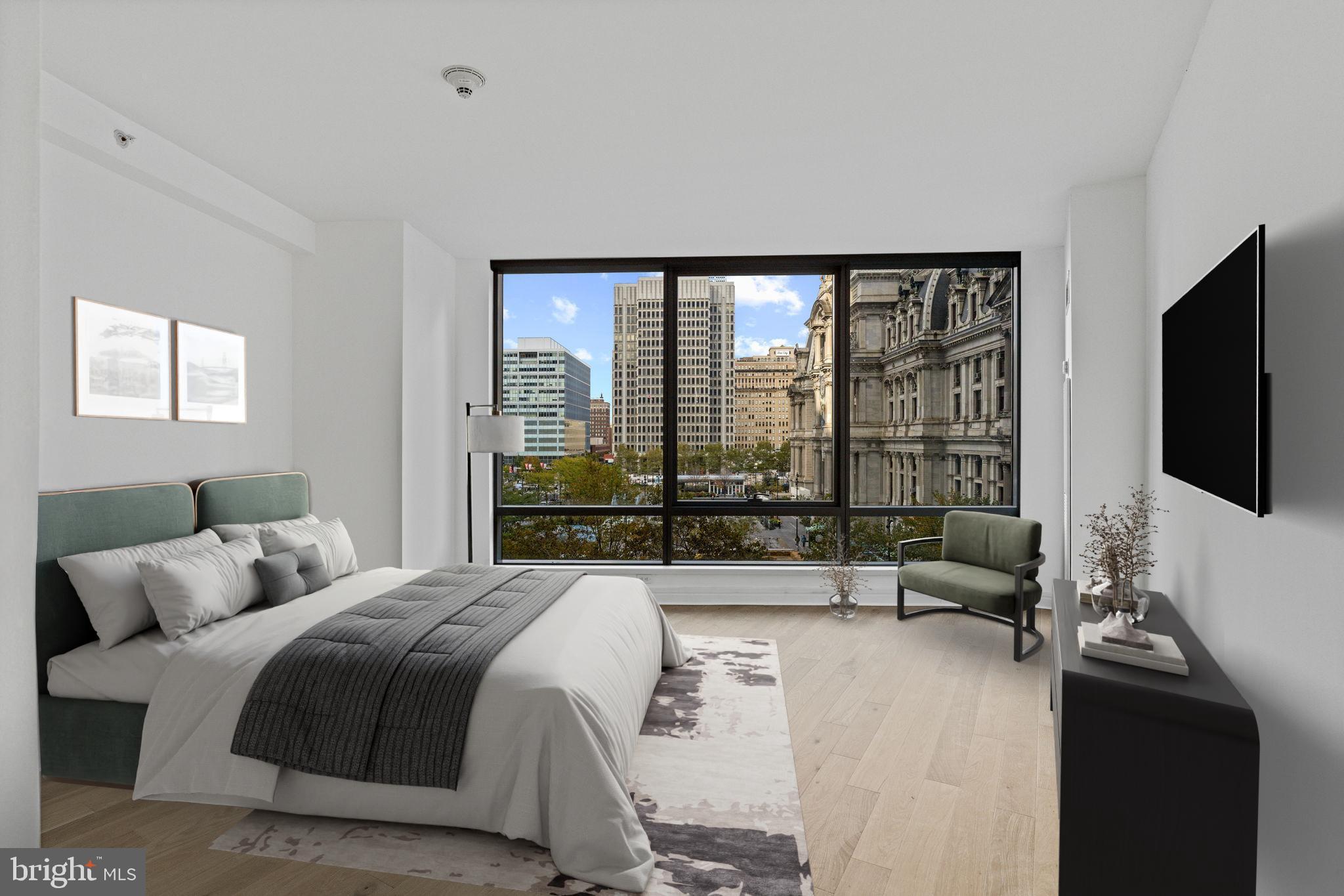 1414 South Penn Square, Unit 5B Philadelphia, PA 19102 - Photo 2 of 38 a large bedroom with a bed and large window