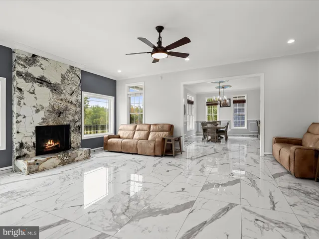 a kitchen with kitchen island granite countertop a stove and a sink