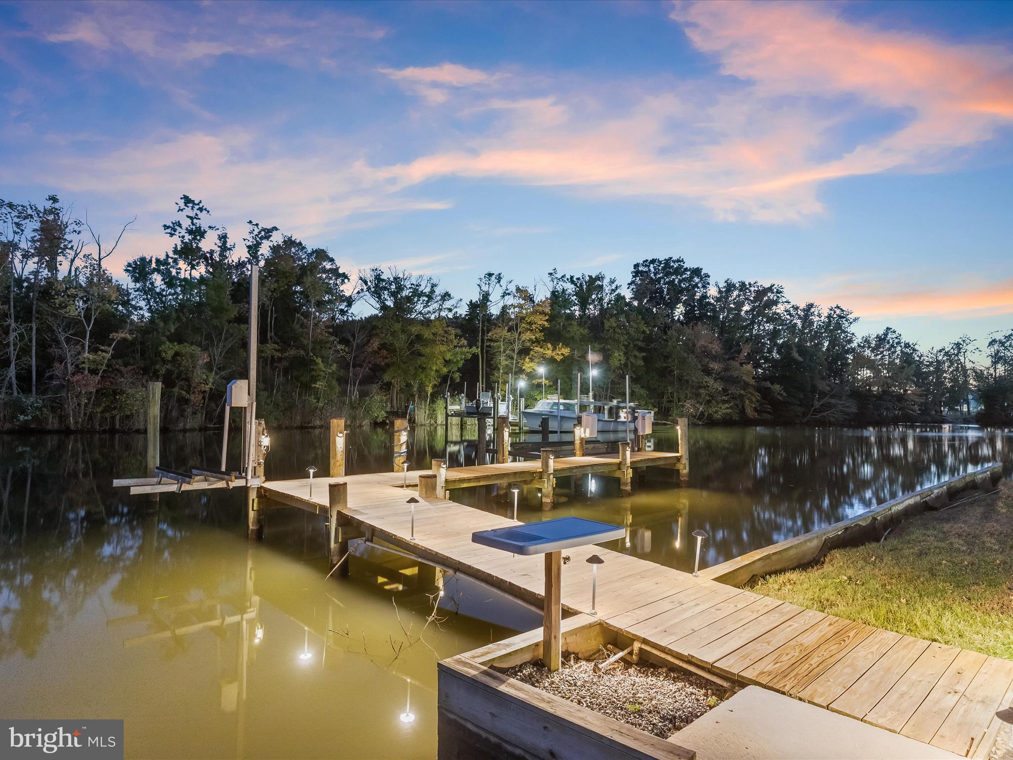1315 South Seneca Road Middle River, MD 21220 - Photo 112 of 127 a view of a lake with couches in the patio next to a lake view