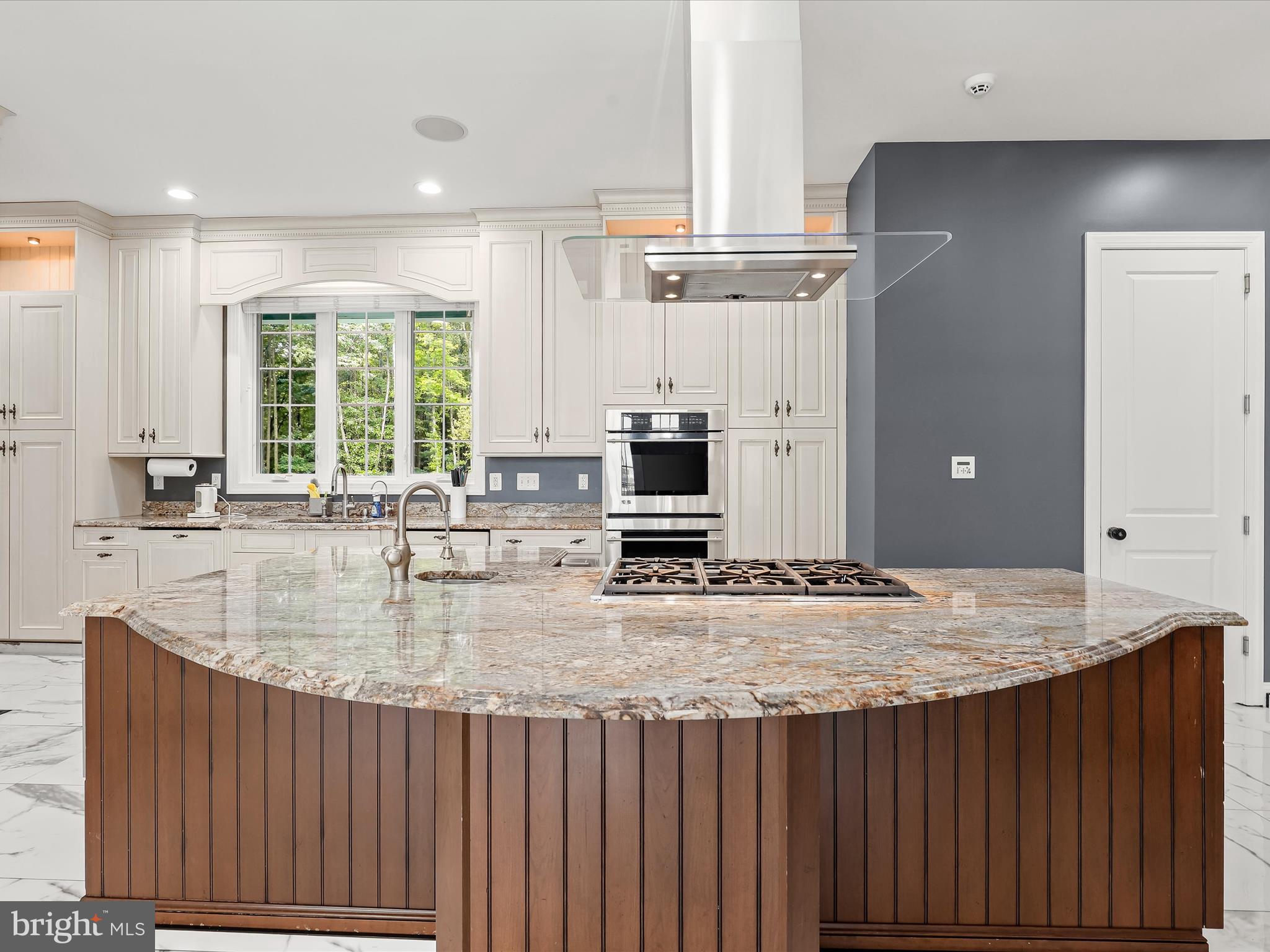 1315 South Seneca Road Middle River, MD 21220 - Photo 22 of 127 a kitchen with kitchen island granite countertop a sink cabinets and window