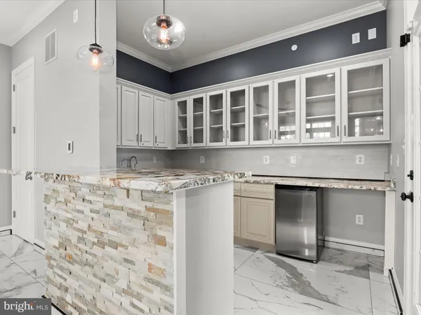 a view of livingroom with kitchen