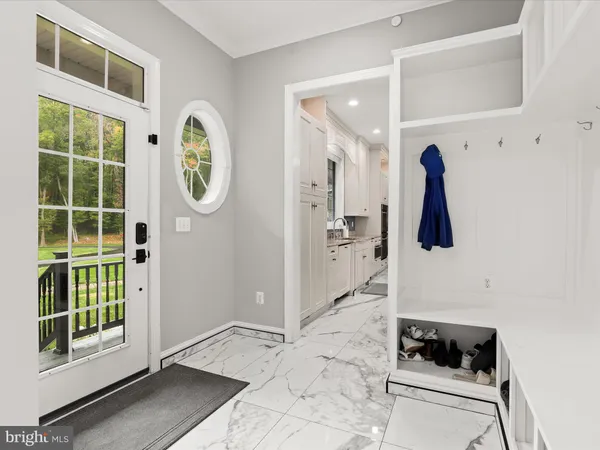 a bedroom with a bed and a mirror on dresser