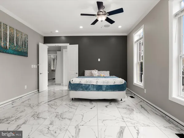 a bathroom with a sink toilet a mirror and shower