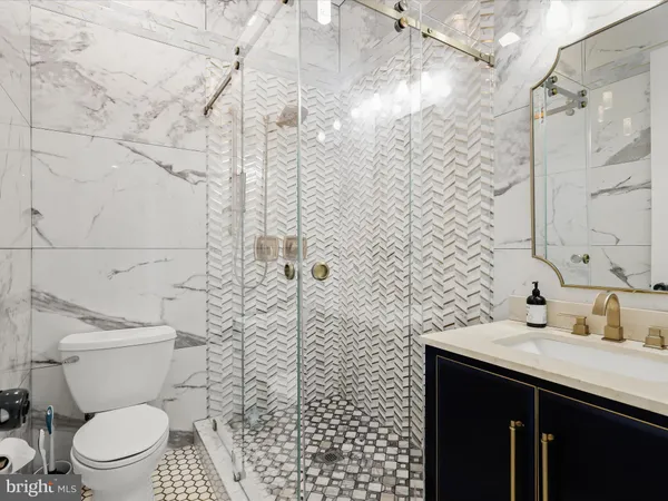 a bathroom with a double vanity sink and mirror