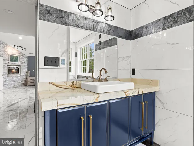 a bathroom with a double vanity sink and mirror