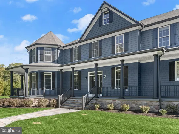 a living room with a fireplace and a large window