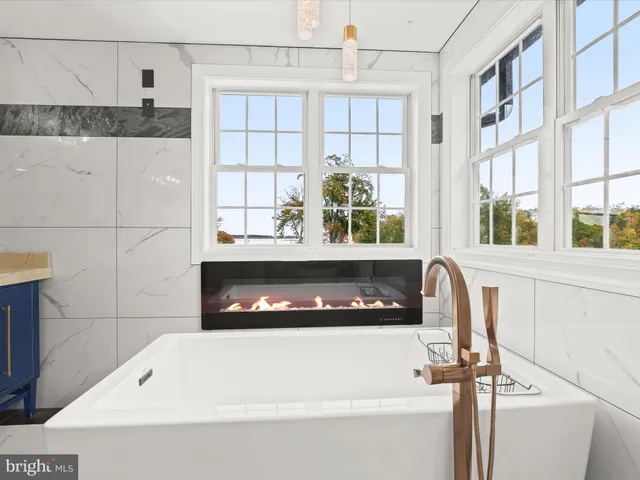 a view of a house with a swimming pool and a yard