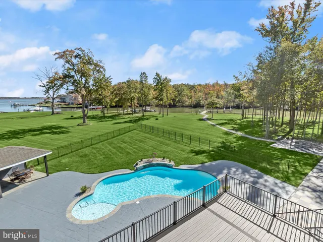 a view of a park with houses in the background