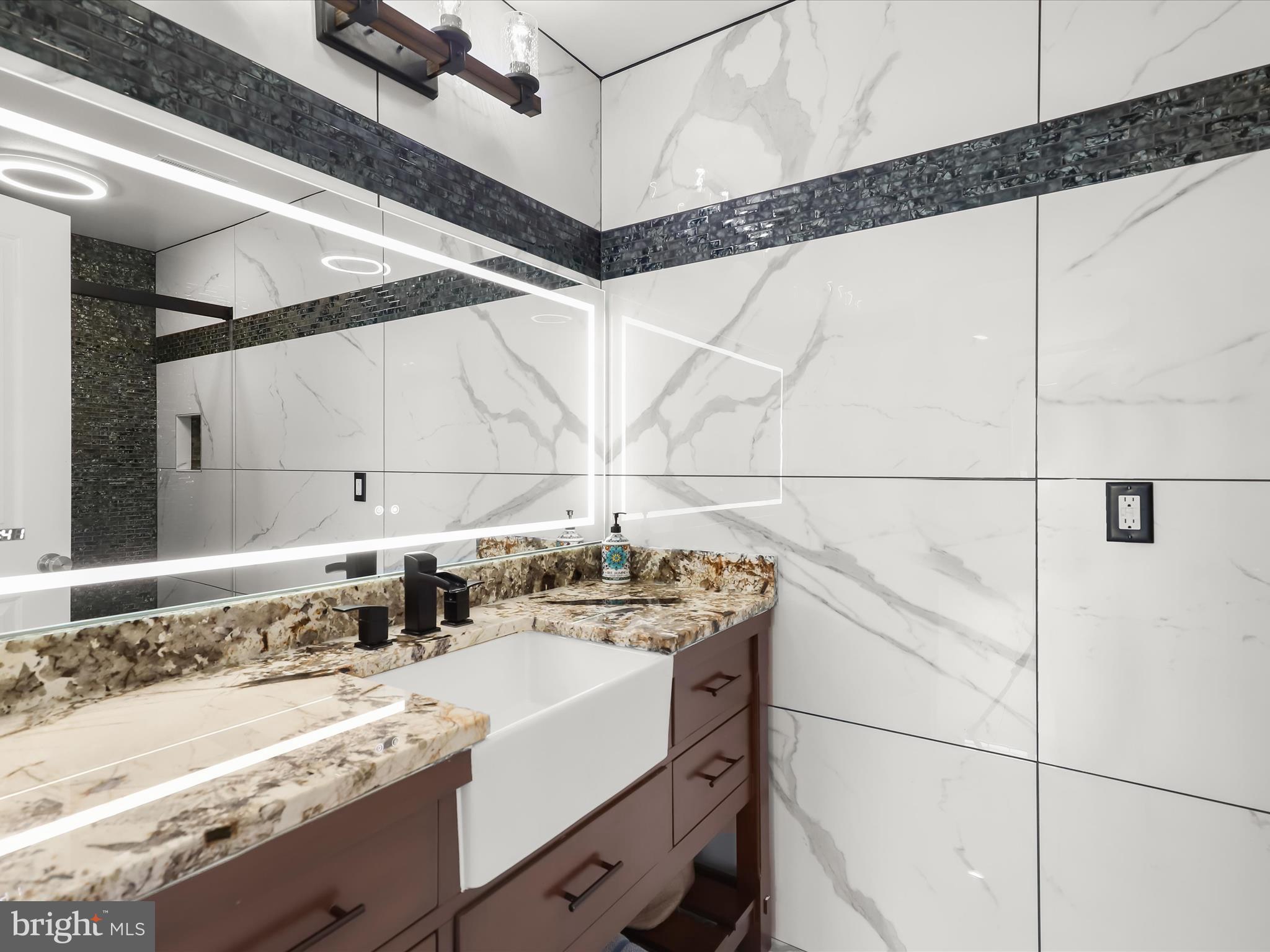 1315 South Seneca Road Middle River, MD 21220 - Photo 51 of 127 a bathroom with a sink and a mirror