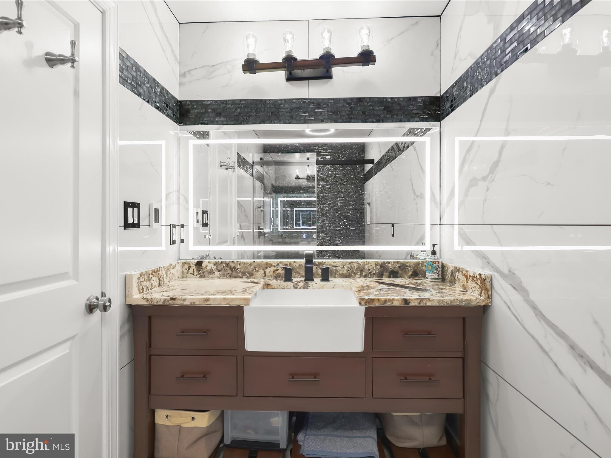 1315 South Seneca Road Middle River, MD 21220 - Photo 52 of 127 a bathroom with a sink and a mirror