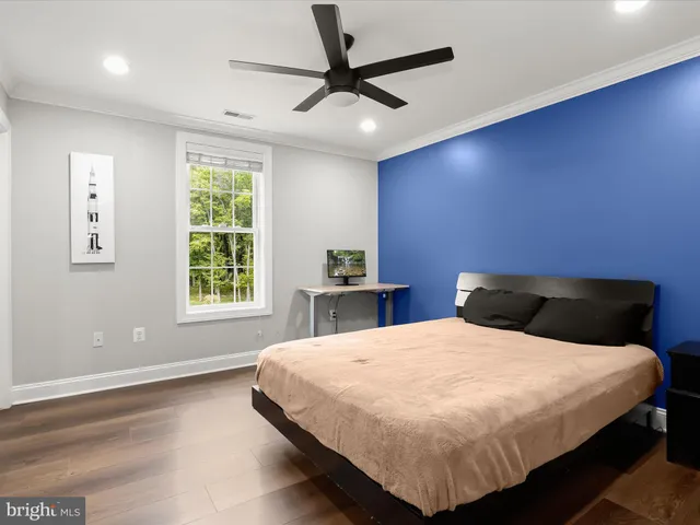a view of a lake with couches in the patio next to a lake view