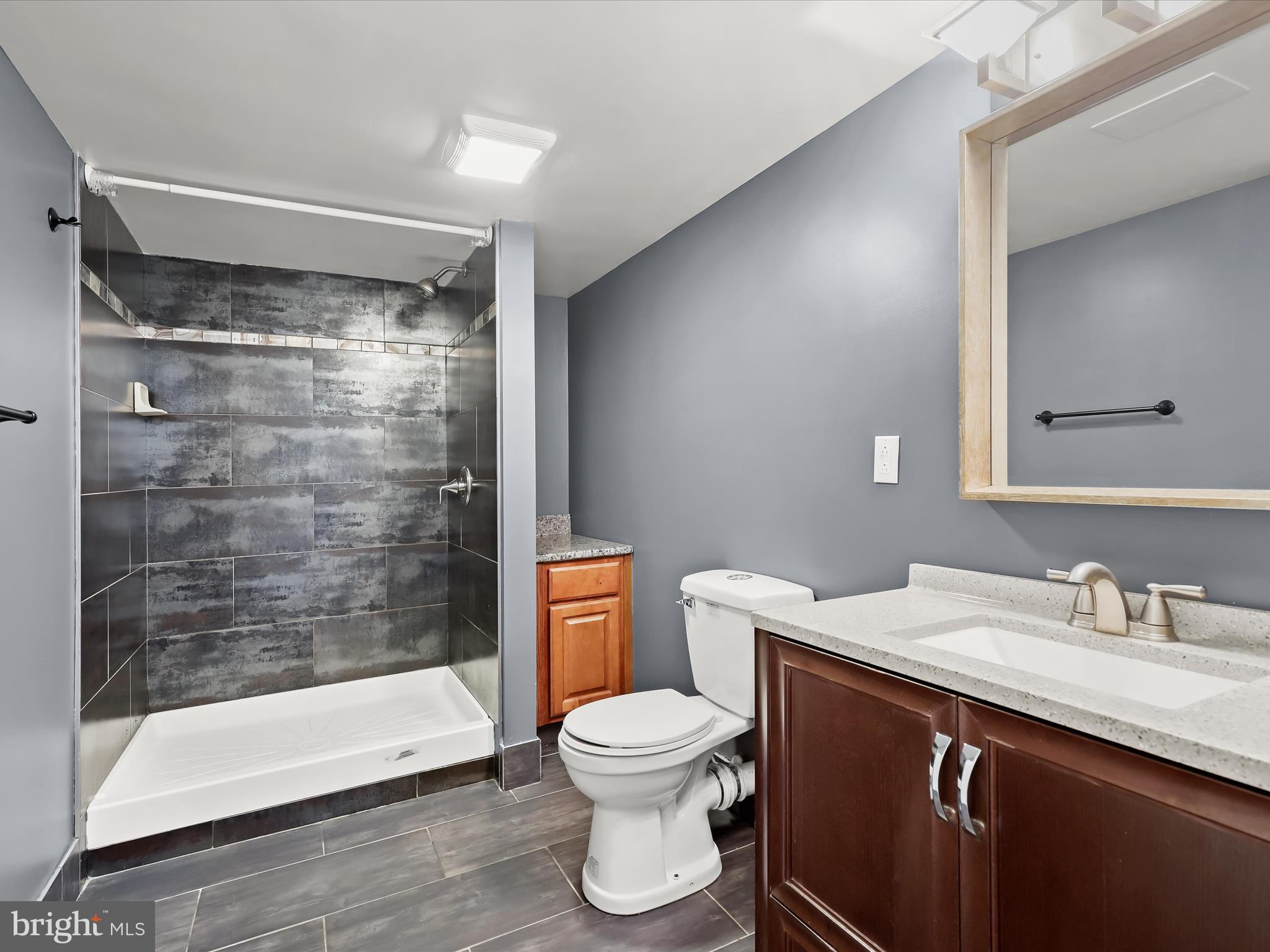 1315 South Seneca Road Middle River, MD 21220 - Photo 65 of 127 a bathroom with a sink toilet a mirror and shower