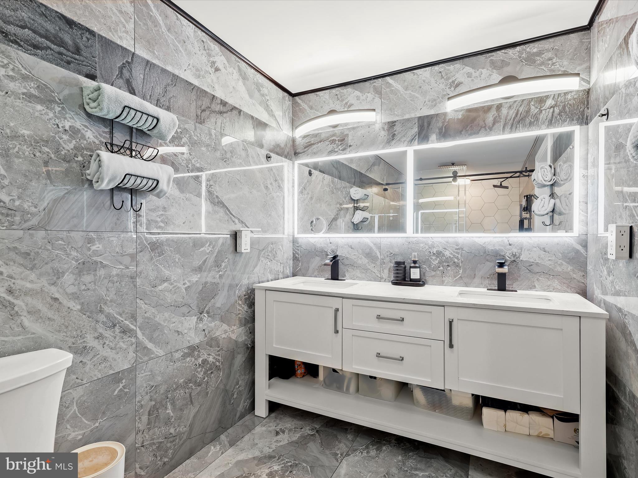 1315 South Seneca Road Middle River, MD 21220 - Photo 67 of 127 a bathroom with a double vanity sink and mirror